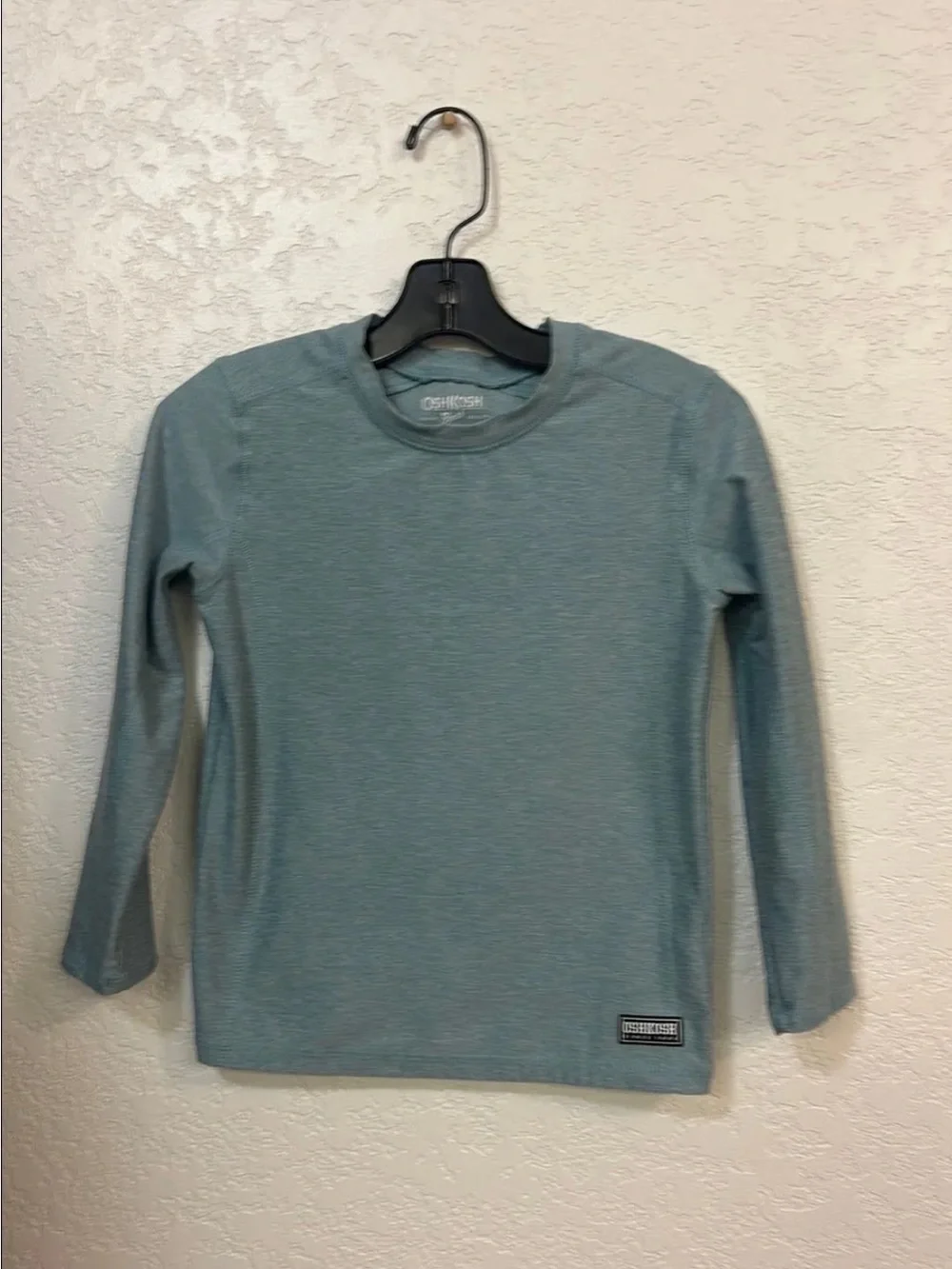 OshKosh Active Long Sleeve Active Top in a light blue heathered color.